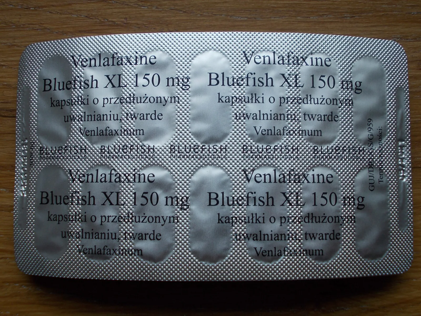 The foil back of a blister strip printed with the drug name, brand and strength several times over